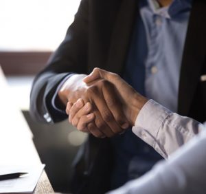 Two people shaking hands